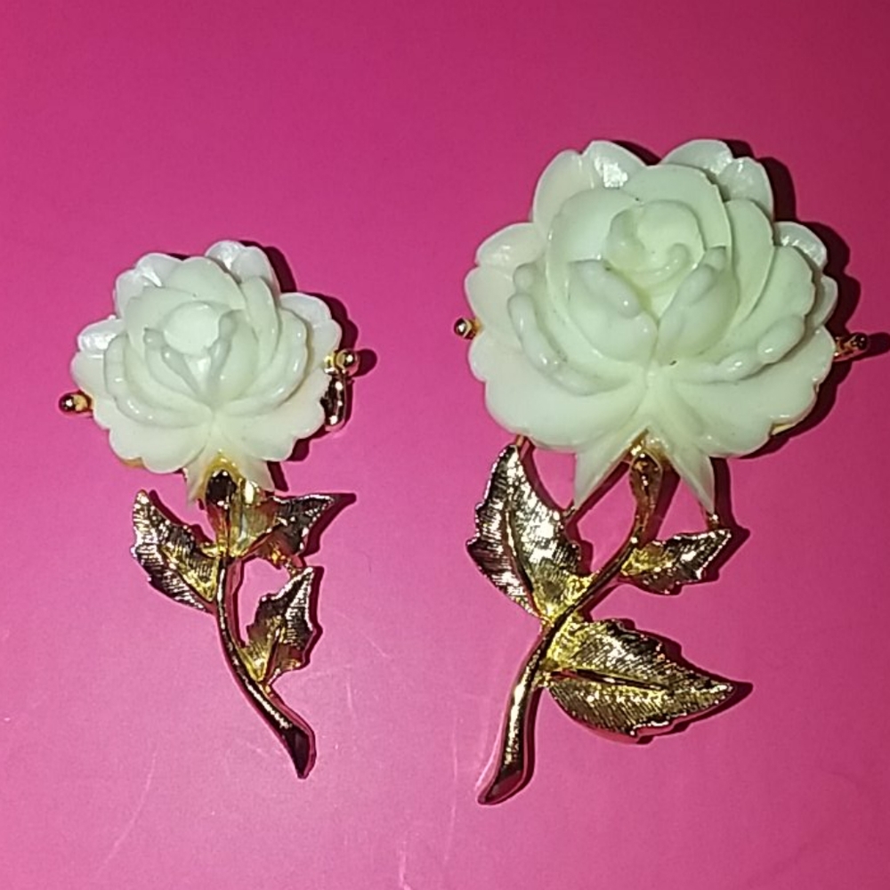 2 Lucite carved rose brooches